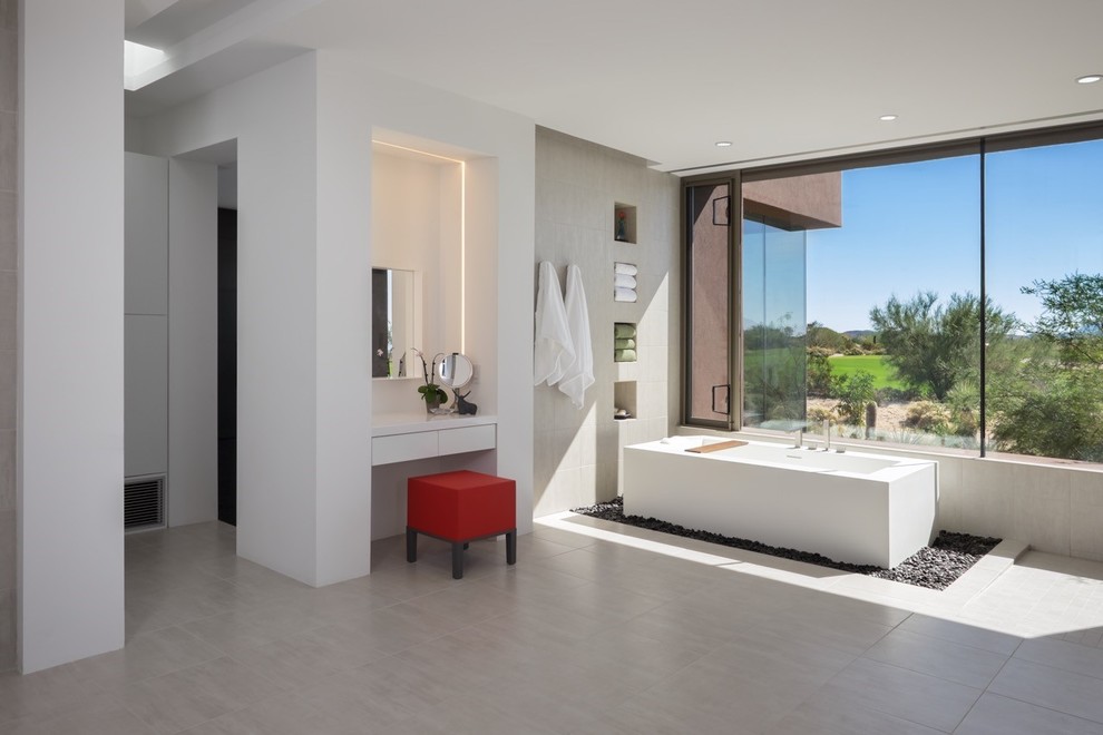 Large master bathroom in Phoenix with engineered quartz benchtops, gray tile, white walls, an open shower, a freestanding tub, flat-panel cabinets, dark wood cabinets, a one-piece toilet, porcelain tile, porcelain floors, an integrated sink, grey floor and white benchtops.