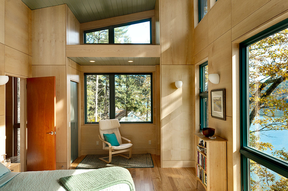 Contemporary bedroom in Burlington with medium hardwood floors.