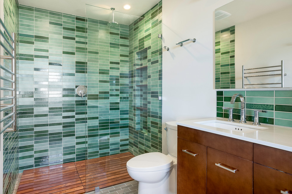 Design ideas for a mid-sized contemporary master bathroom in San Francisco with flat-panel cabinets, brown cabinets, green tile, white walls, an undermount sink, an open shower, white benchtops, a curbless shower and ceramic tile.