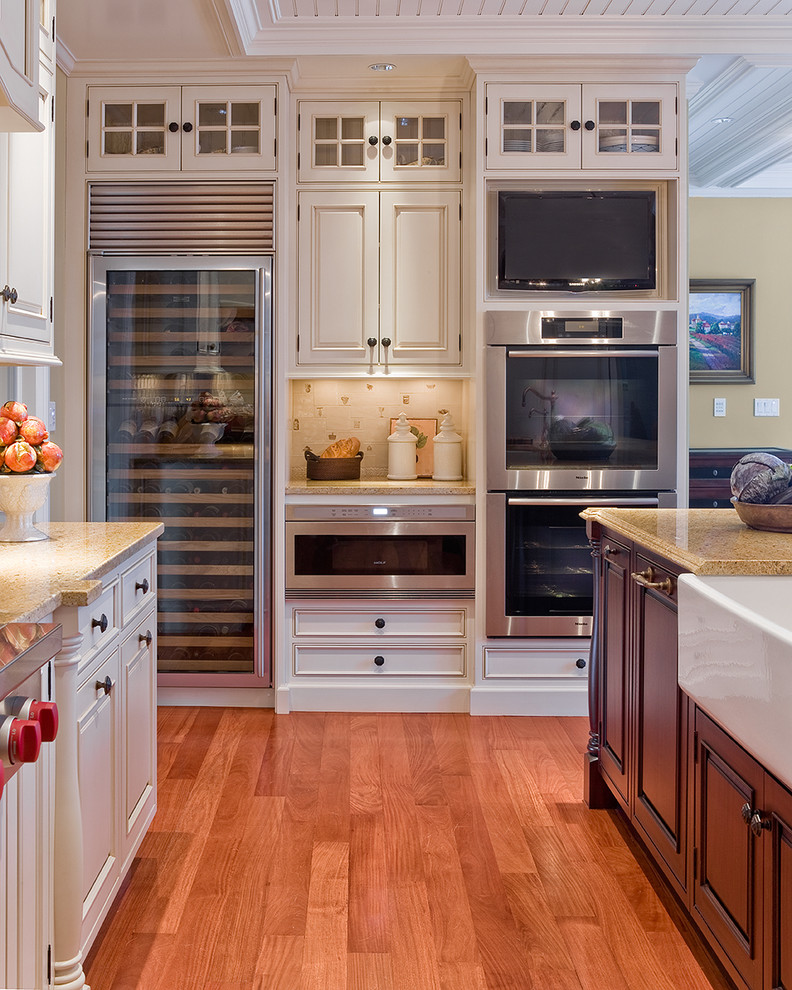 Inspiration for a traditional kitchen in Boston with beaded inset cabinets, stainless steel appliances, a farmhouse sink and white cabinets.