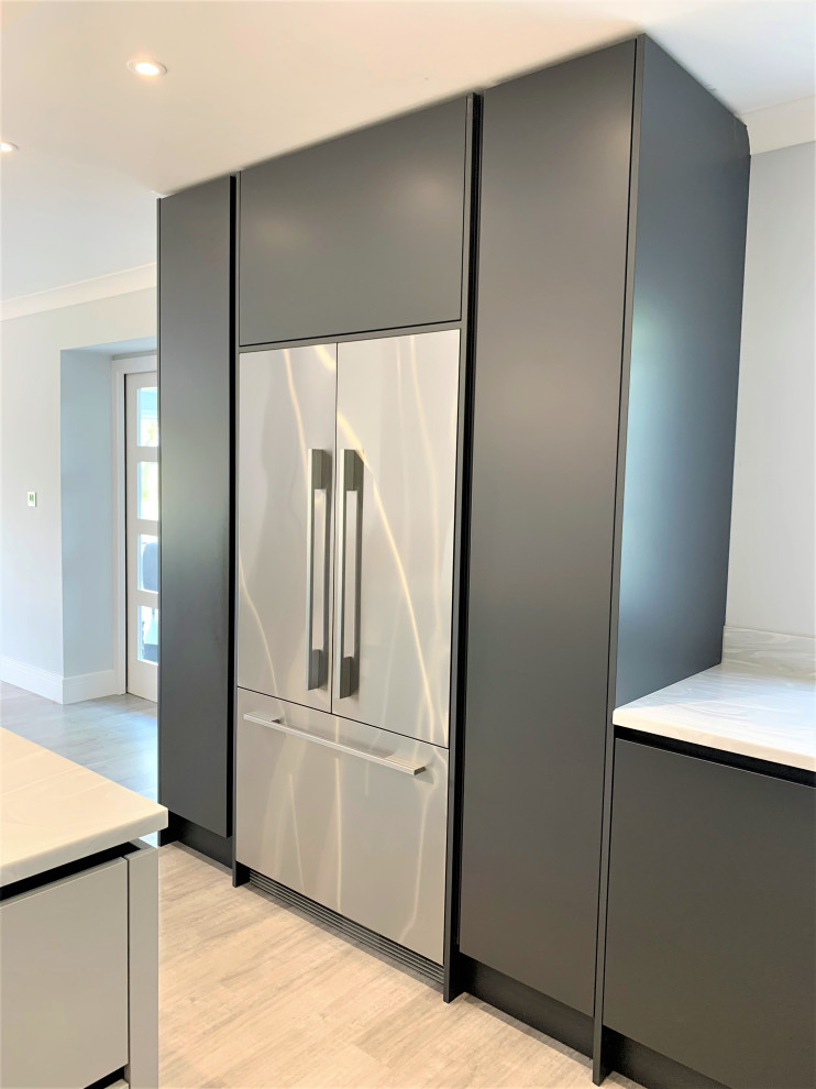 Photo of a large contemporary u-shaped open plan kitchen in Other with a double-bowl sink, medium wood cabinets, solid surface benchtops, glass sheet splashback, black appliances, with island, white benchtop and recessed.