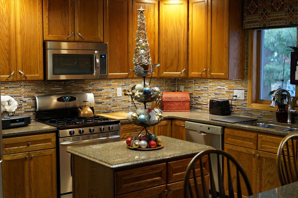 Inspiration for a mid-sized transitional u-shaped vinyl floor open concept kitchen remodel in Cedar Rapids with a double-bowl sink, recessed-panel cabinets, medium tone wood cabinets, quartz countertops, multicolored backsplash, glass sheet backsplash, stainless steel appliances and an island
