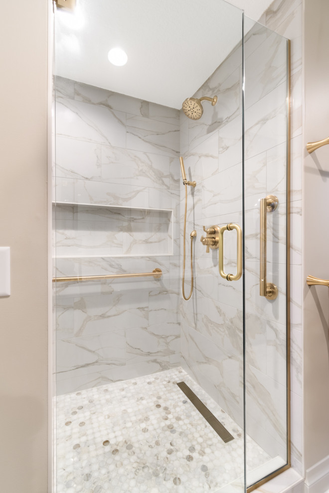 Alcove shower - transitional white tile and porcelain tile alcove shower idea in Minneapolis with beige walls and a hinged shower door