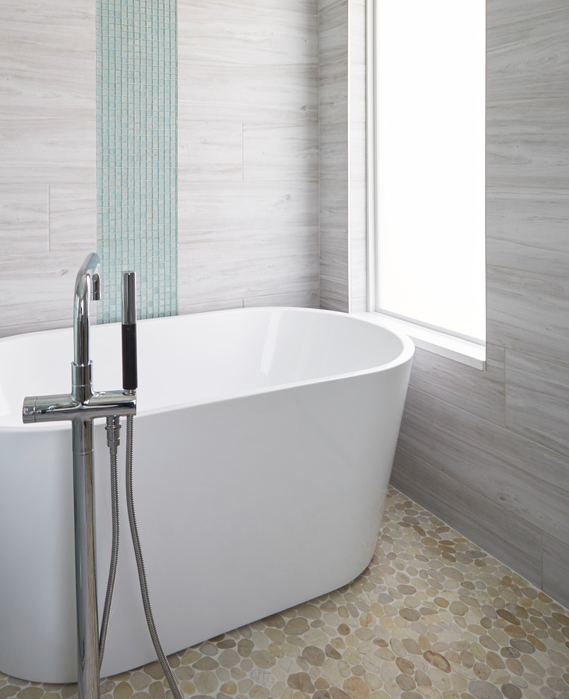 This is an example of a large beach style master wet room bathroom in Other with shaker cabinets, white cabinets, a freestanding tub, a two-piece toilet, white tile, porcelain tile, white walls, wood-look tile, an undermount sink, engineered quartz benchtops, grey floor, a sliding shower screen, white benchtops, an enclosed toilet, a double vanity and a freestanding vanity.