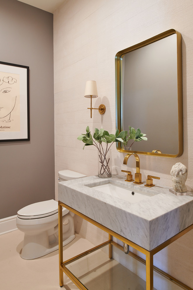 Design ideas for a transitional powder room in Los Angeles with a two-piece toilet, grey walls, a console sink and beige floor.