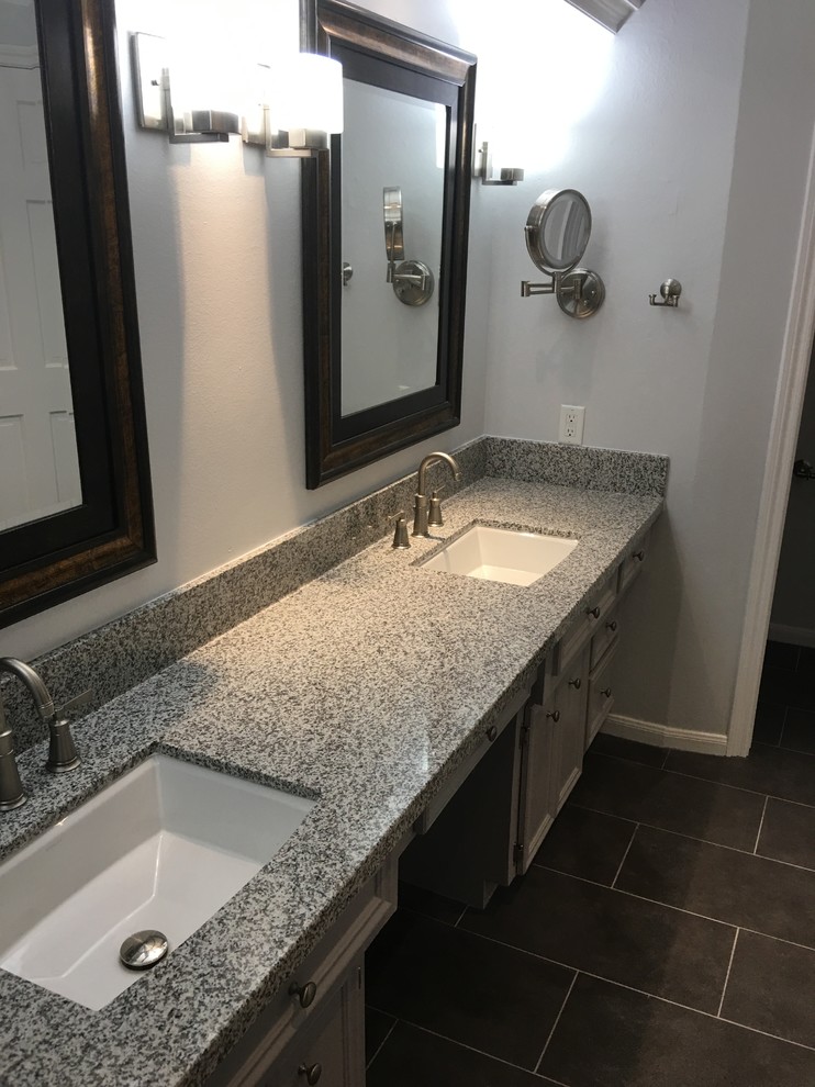 Inspiration for a large transitional master white tile and subway tile mosaic tile floor and white floor alcove shower remodel with beaded inset cabinets, beige cabinets, a two-piece toilet, gray walls, an undermount sink, solid surface countertops and gray countertops