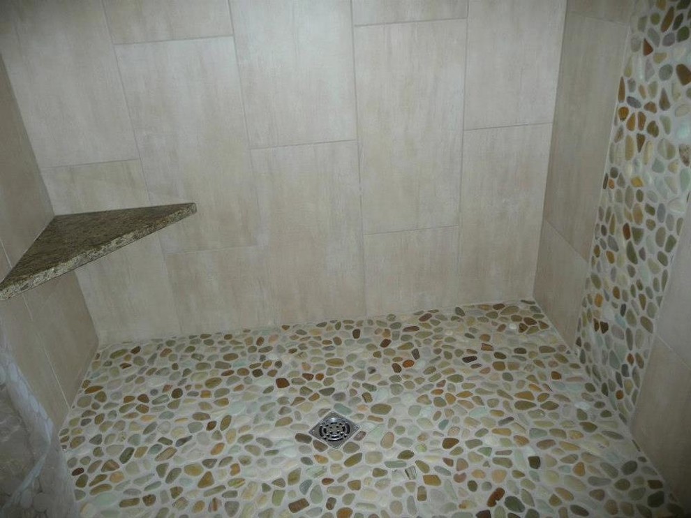 Mid-sized transitional master beige tile and porcelain tile pebble tile floor alcove shower photo in Milwaukee with white walls