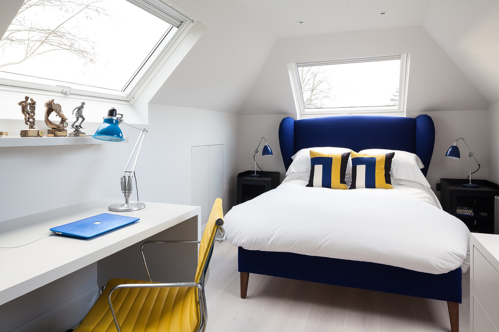 Small contemporary guest bedroom in Kent with white walls and light hardwood floors.