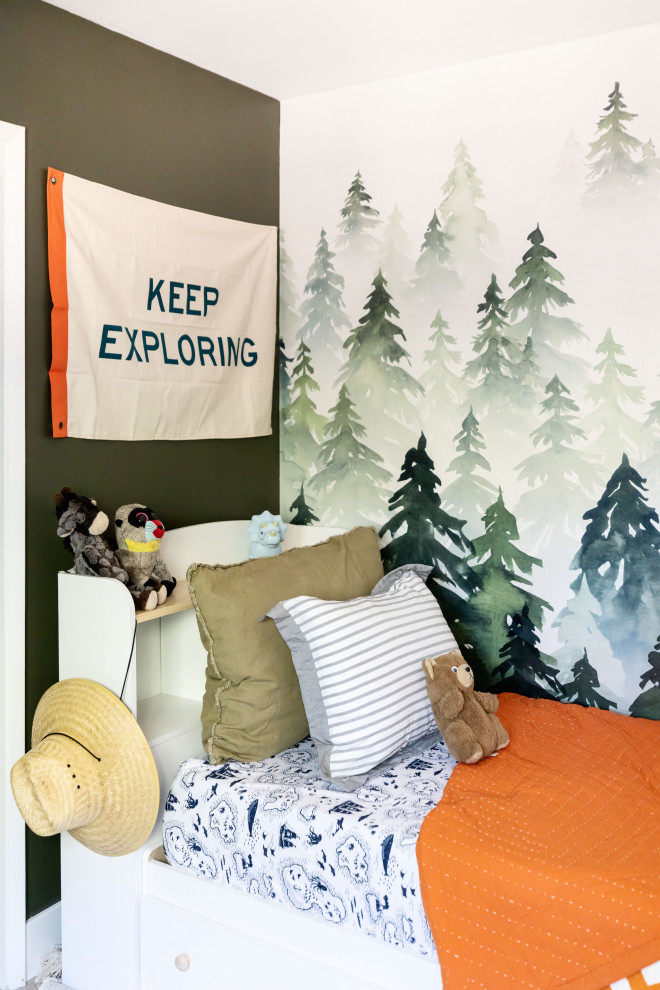 This is an example of a small beach style toddler’s room for boys in San Francisco with green walls and wallpapered walls.