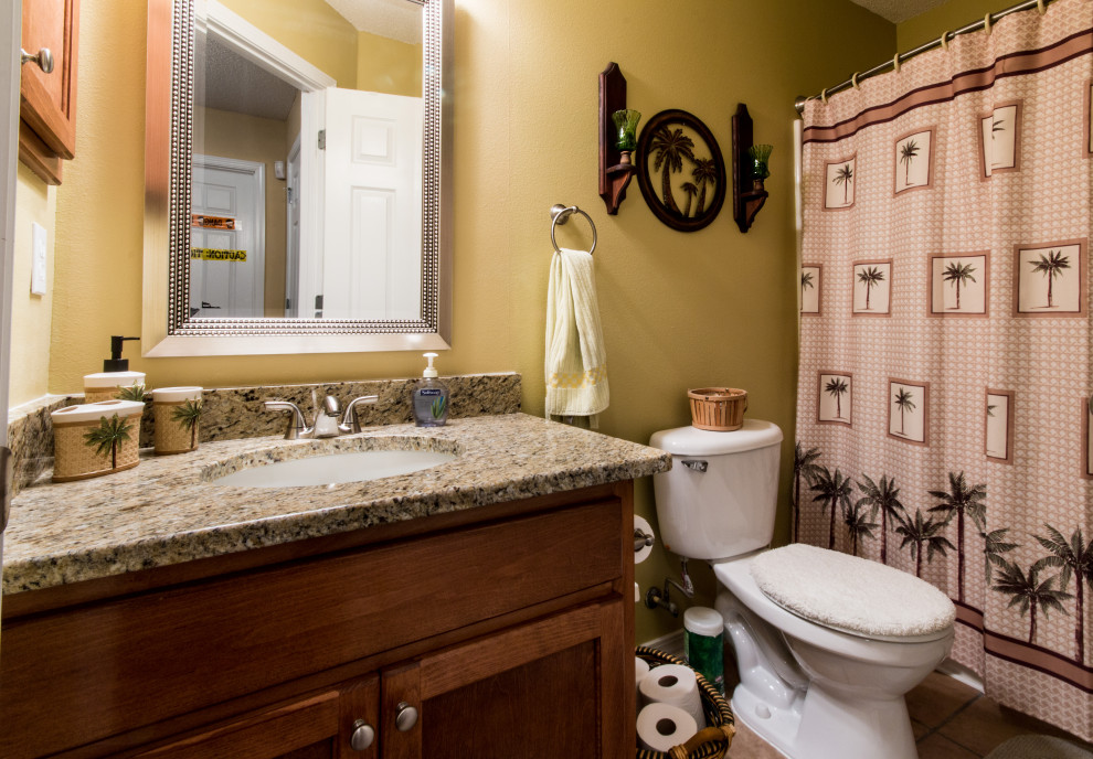 Example of a mid-sized single-sink bathroom design with raised-panel cabinets and a built-in vanity