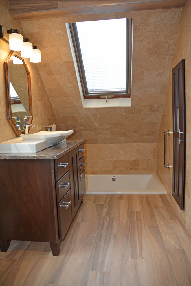 Photo of a small asian master bathroom in Other with furniture-like cabinets, dark wood cabinets, a drop-in tub, an alcove shower, a two-piece toilet, brown tile, ceramic tile, brown walls, ceramic floors, a vessel sink, engineered quartz benchtops, beige floor, a hinged shower door and multi-coloured benchtops.