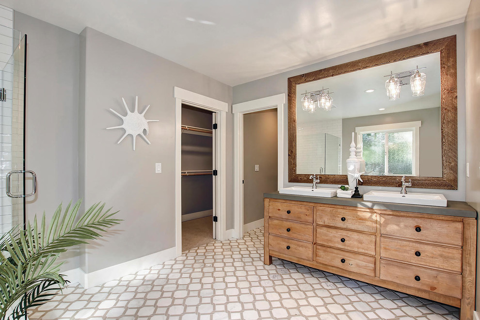 Photo of a mid-sized traditional bathroom in Sacramento with recessed-panel cabinets, medium wood cabinets, white tile, grey walls, mosaic tile floors, concrete benchtops, white floor and a hinged shower door.