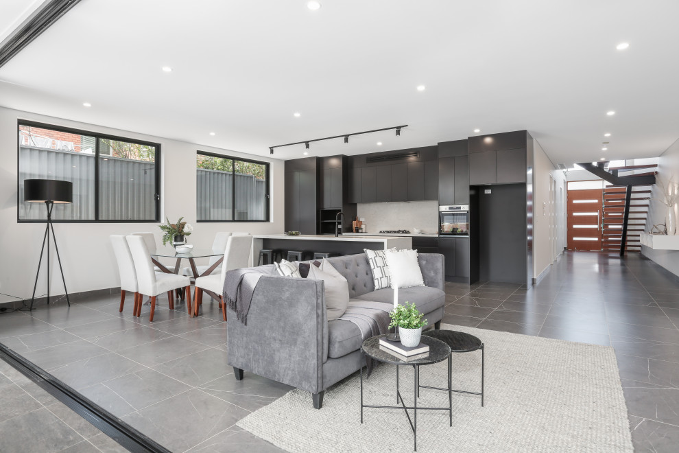This is an example of a small modern formal open plan living room in Sydney with white walls, ceramic flooring, no fireplace, a built-in media unit, grey floors, brick walls and a timber clad ceiling.