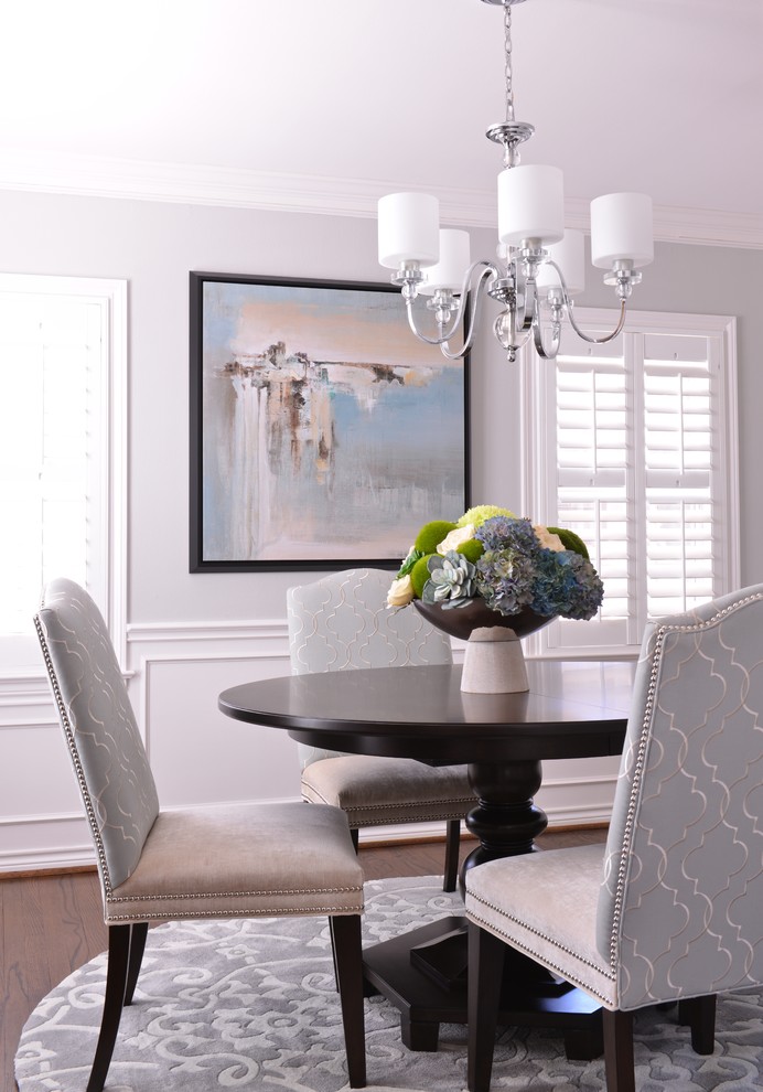 Example of a mid-sized transitional dark wood floor enclosed dining room design in Dallas with gray walls and no fireplace