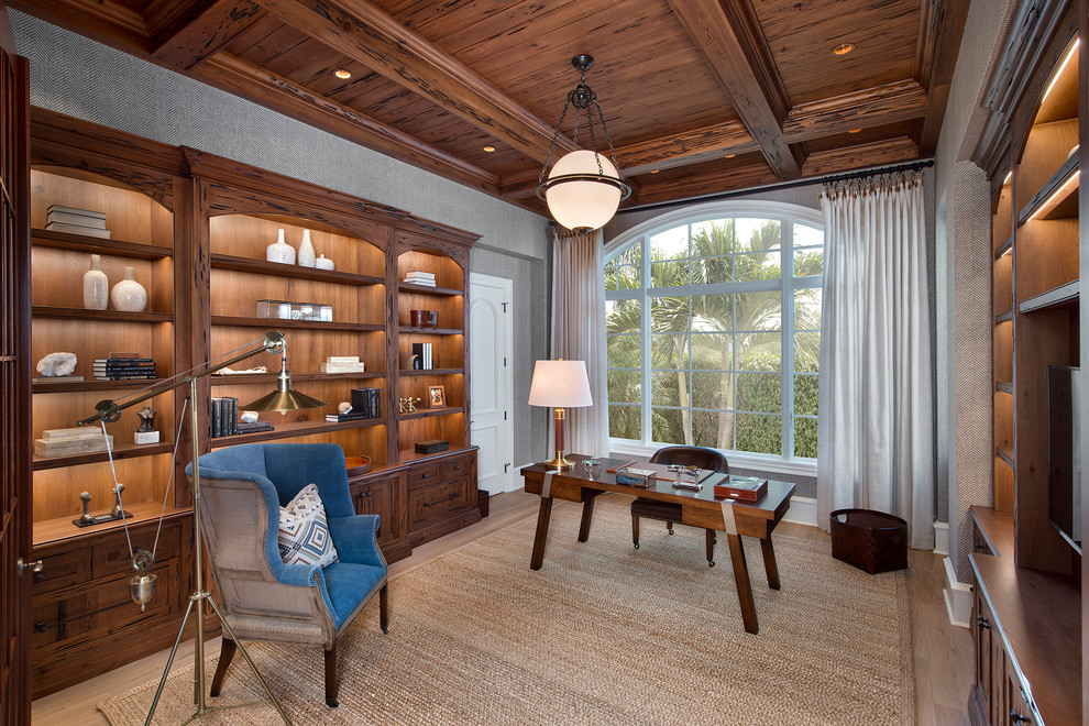 Beach style study room in Cleveland with light hardwood floors and a freestanding desk.