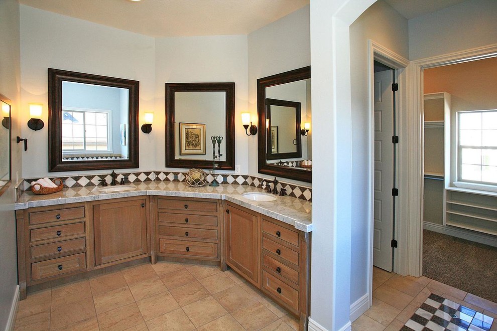 Large traditional master bathroom in Salt Lake City with an undermount sink, shaker cabinets, light wood cabinets, marble benchtops, a drop-in tub, an alcove shower, blue walls, travertine floors, black and white tile and mosaic tile.