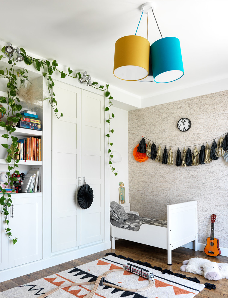 Design ideas for a transitional gender-neutral kids' room in Moscow with beige walls and dark hardwood floors.