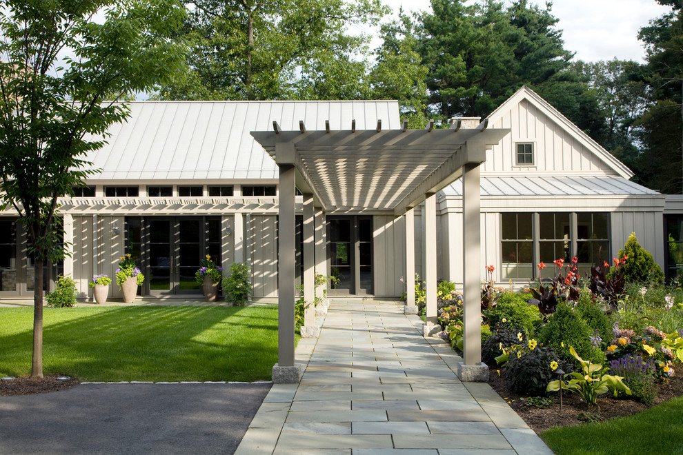 This is an example of a transitional white exterior in Boston with a gable roof.
