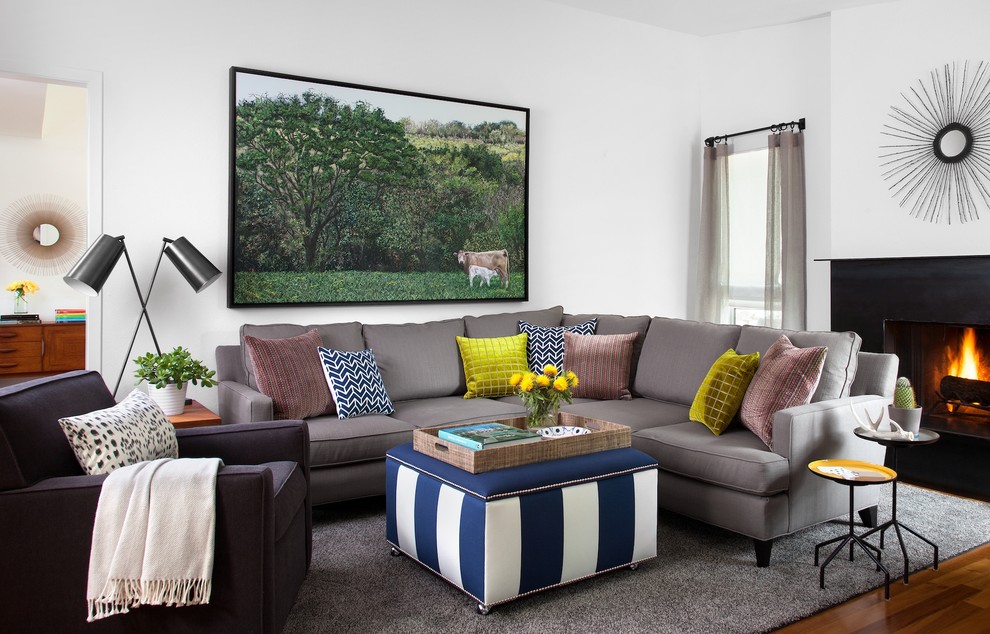 This is an example of a contemporary living room in Austin with white walls.
