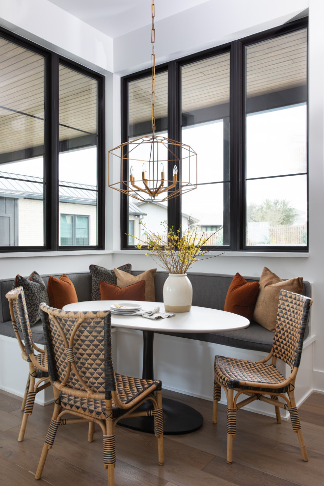 This is an example of a transitional dining room in Austin.