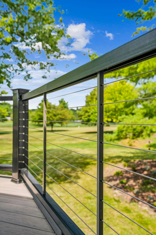Deck - mid-sized transitional backyard second story cable railing deck idea in Columbus with a roof extension