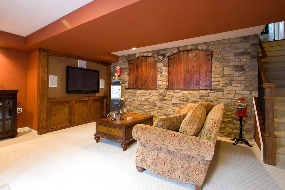 Inspiration for a mid-sized country look-out basement in Denver with red walls, carpet, no fireplace and beige floor.
