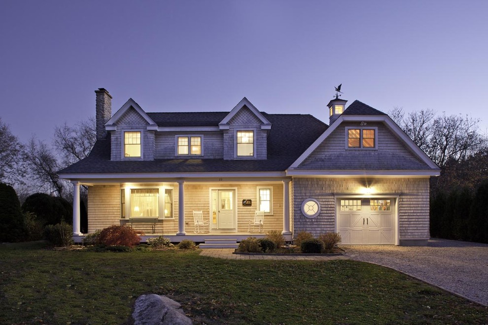 Traditional two-storey exterior in Boston with wood siding and a clipped gable roof.