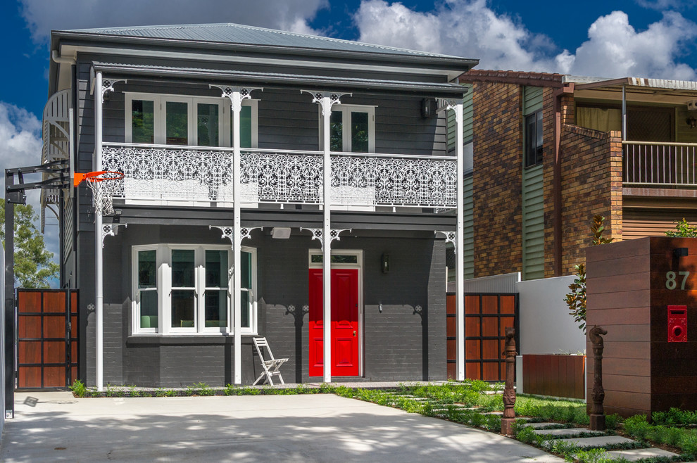 Photo of a contemporary two-storey grey exterior in Brisbane.