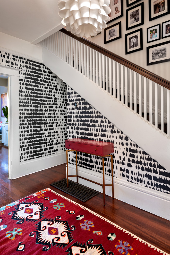 Hallway - small transitional dark wood floor and brown floor hallway idea in San Francisco with multicolored walls
