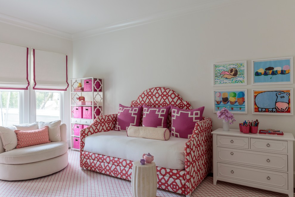 This is an example of a transitional kids' bedroom for kids 4-10 years old and girls in San Francisco with white walls, carpet and multi-coloured floor.