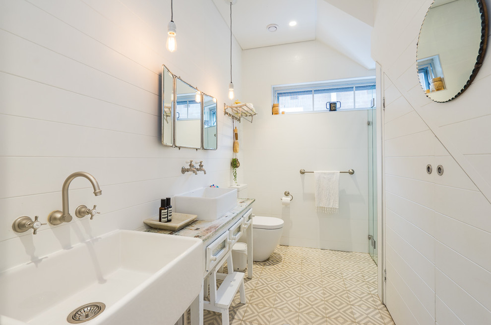 Beach style kids bathroom in Sydney with white cabinets, white walls, a vessel sink and recessed-panel cabinets.