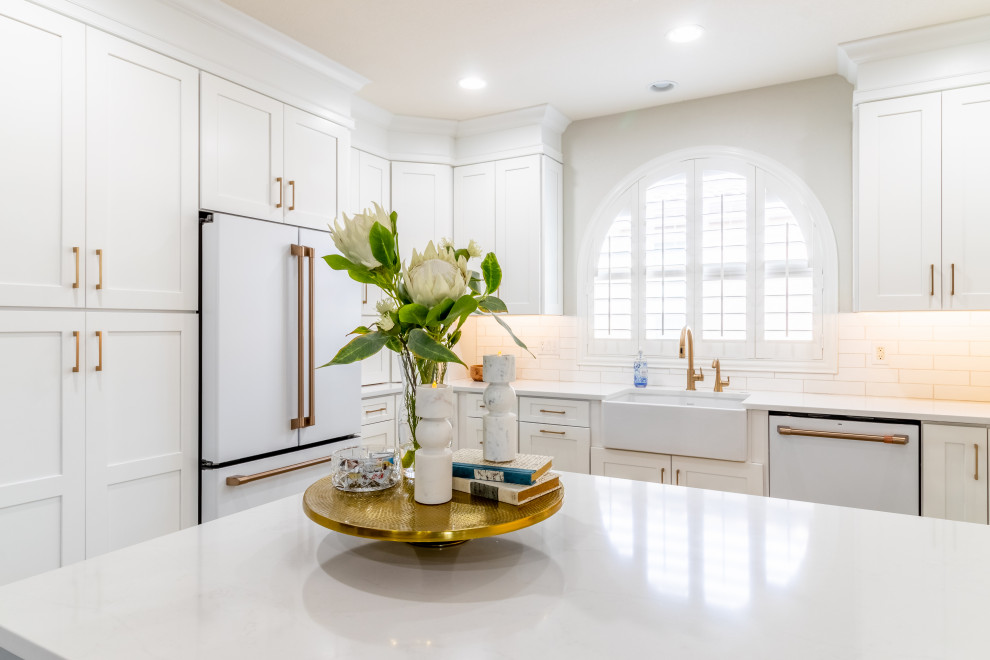Transitional kitchen photo in Phoenix with shaker cabinets, white cabinets, quartz countertops, white backsplash, white appliances and white countertops