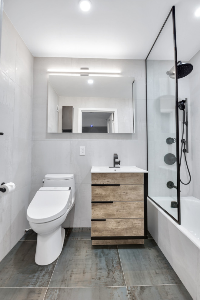 Mid-sized modern kids bathroom in New York with flat-panel cabinets, brown cabinets, a drop-in tub, an open shower, a bidet, beige tile, porcelain tile, beige walls, porcelain floors, a drop-in sink, laminate benchtops, green floor, an open shower and white benchtops.