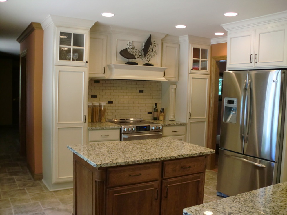 Kitchen - mid-sized transitional u-shaped kitchen idea with recessed-panel cabinets and an island
