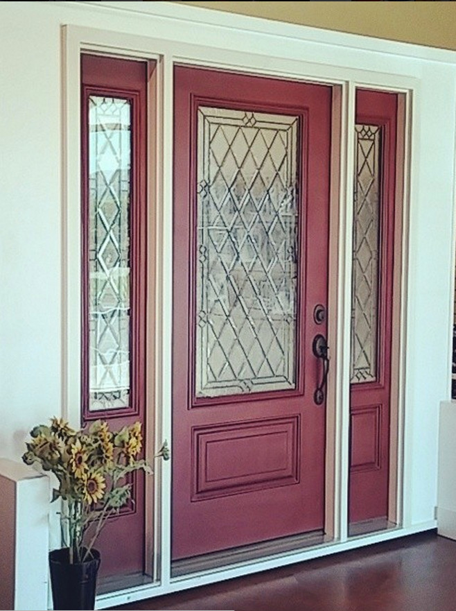 Inspiration for a mid-sized front door in St Louis with yellow walls, dark hardwood floors, a single front door and a red front door.