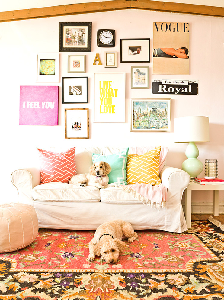 Design ideas for a traditional family room in Chicago with pink walls.