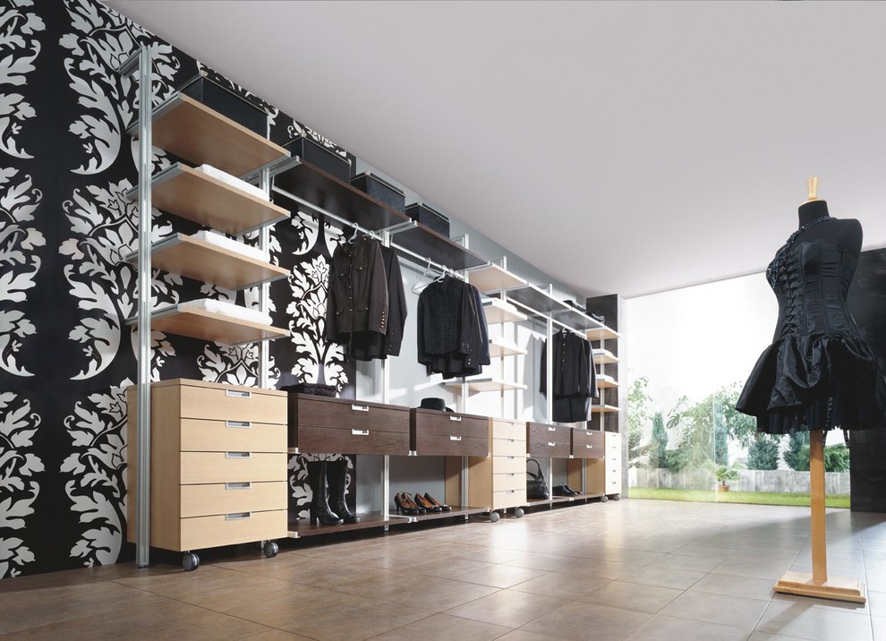 Inspiration for a large contemporary women's built-in wardrobe in Glasgow with open cabinets, light wood cabinets and terra-cotta floors.