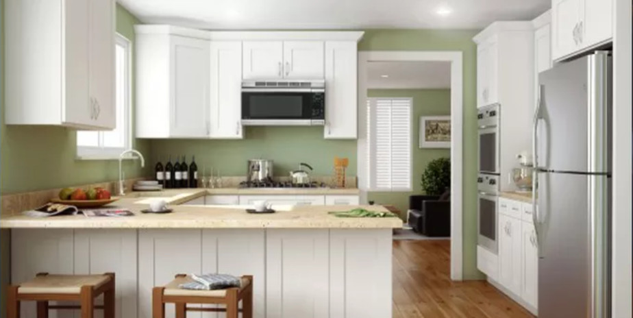 Example of a mid-sized transitional u-shaped medium tone wood floor and brown floor open concept kitchen design in Orlando with an undermount sink, shaker cabinets, white cabinets, quartz countertops, stainless steel appliances, an island and beige countertops