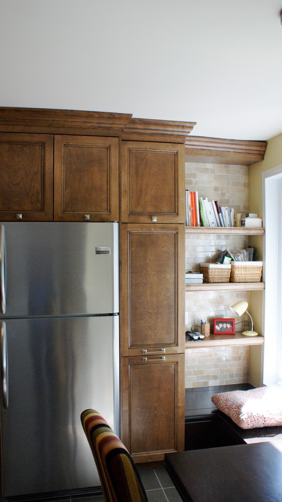 Inspiration for a small transitional eat-in kitchen remodel with a drop-in sink, shaker cabinets, brown cabinets, laminate countertops, multicolored backsplash, stone slab backsplash, stainless steel appliances and an island