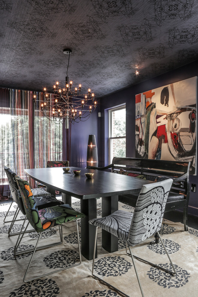 Contemporary dining room in New York with black walls.