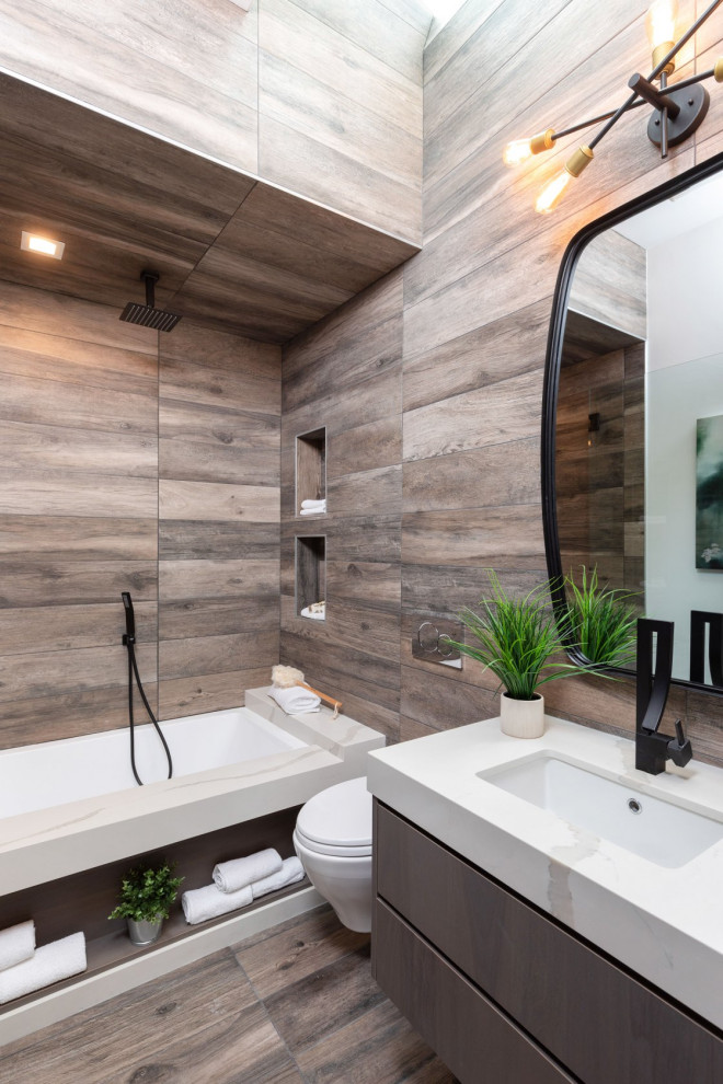 This is an example of a contemporary bathroom in Orange County with flat-panel cabinets, grey cabinets, an alcove tub, a shower/bathtub combo, brown tile, wood-look tile, an undermount sink, brown floor, an open shower, white benchtops, a single vanity and a floating vanity.