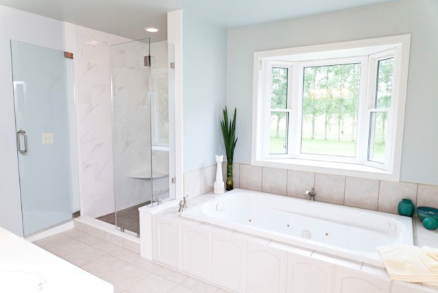 Example of a mid-sized transitional master porcelain tile ceramic tile alcove bathtub design in Charlotte with raised-panel cabinets, white cabinets, quartz countertops and blue walls