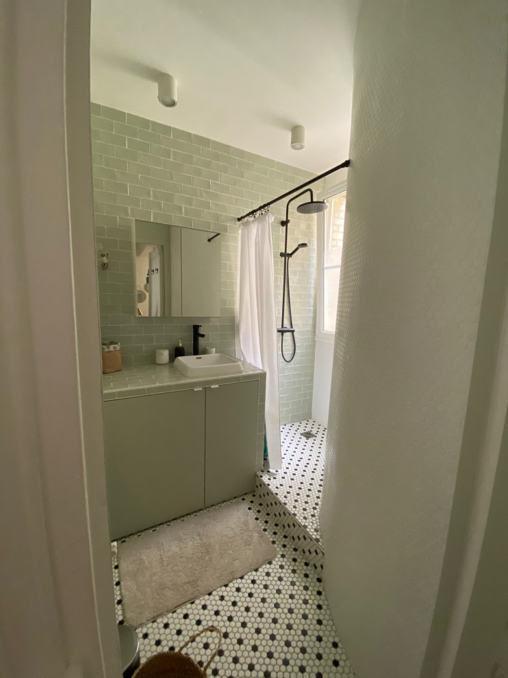 Design ideas for a small 3/4 bathroom in Other with green tile, a single vanity, beaded inset cabinets, green cabinets, an open shower, green walls, mosaic tile floors, an undermount sink, tile benchtops, green benchtops, a laundry and a freestanding vanity.
