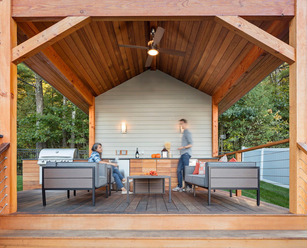 Design ideas for a large country deck in Boston with an outdoor kitchen and a pergola.