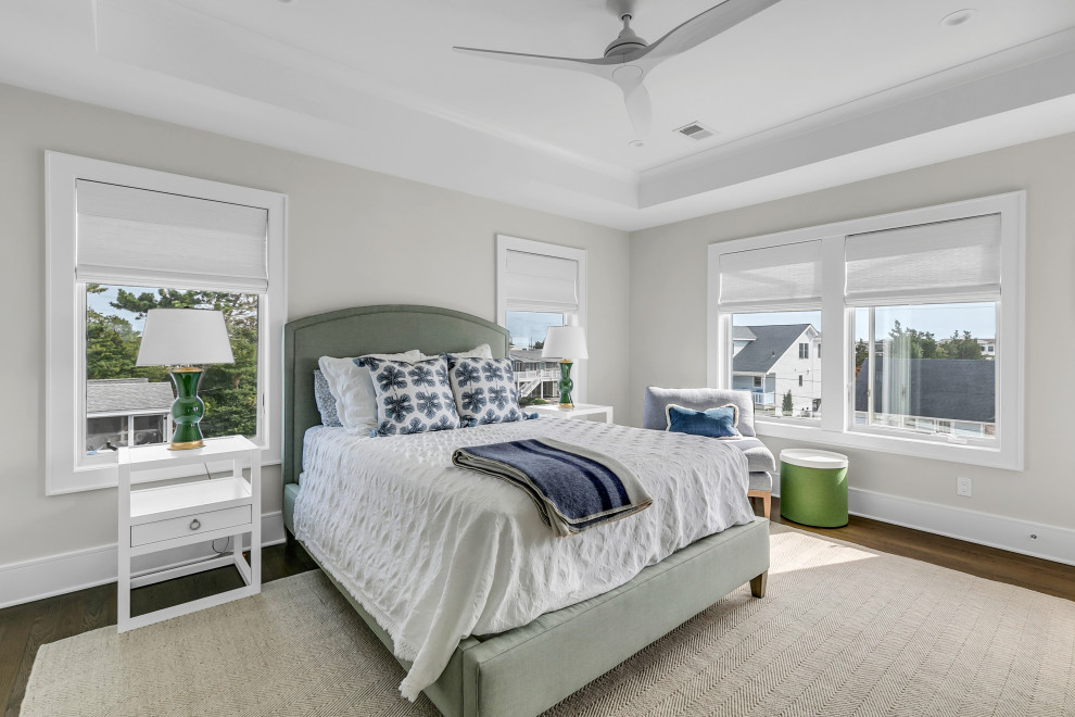 Photo of a large coastal bedroom in Austin.