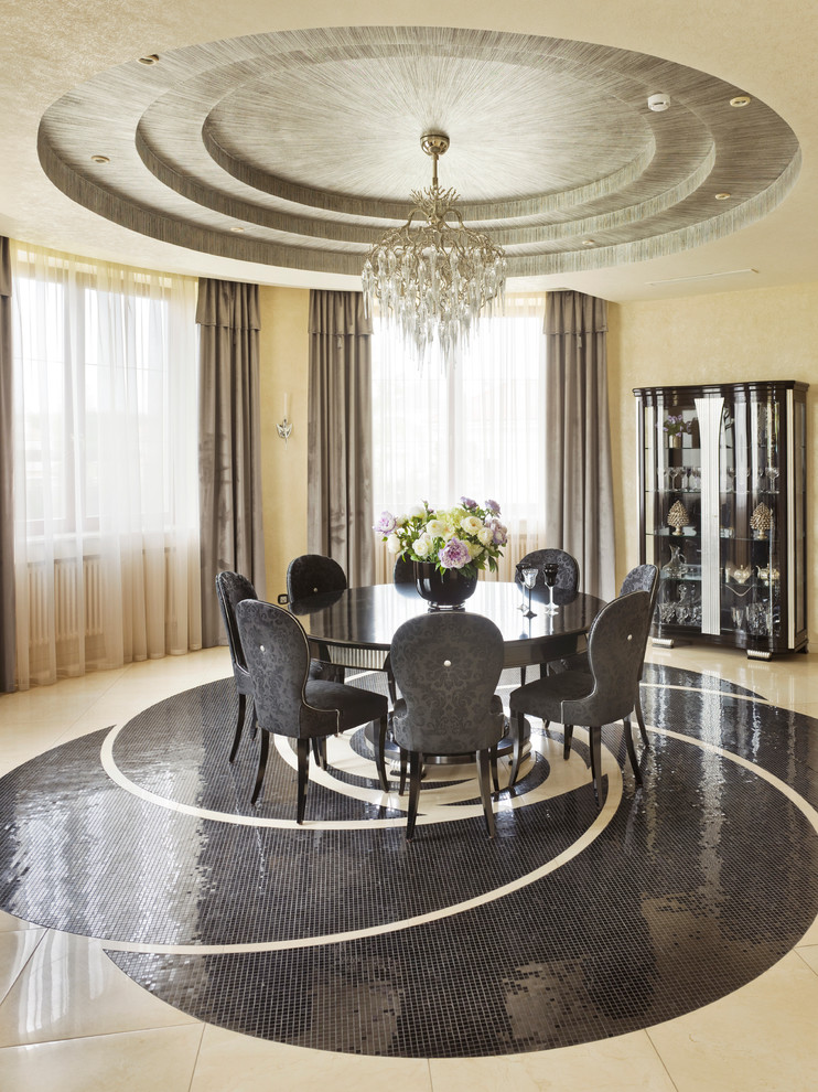Photo of a large contemporary open plan dining in Milan with beige walls and marble floors.