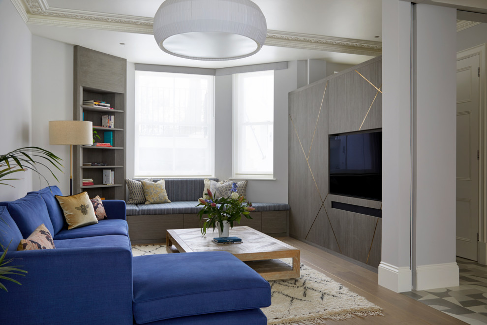 Photo of a medium sized modern living room in London with grey walls, a built-in media unit, brown floors and a coffered ceiling.