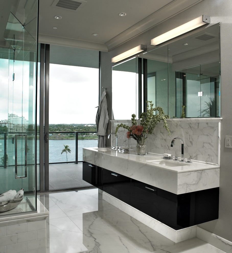Photo of a large contemporary master bathroom in Miami with an undermount sink, flat-panel cabinets, white tile, dark wood cabinets, stone slab and quartzite benchtops.