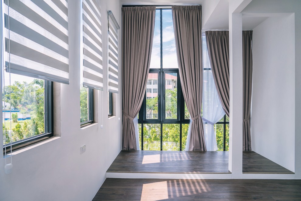 Inspiration for a modern medium tone wood floor and brown floor home design remodel with white walls