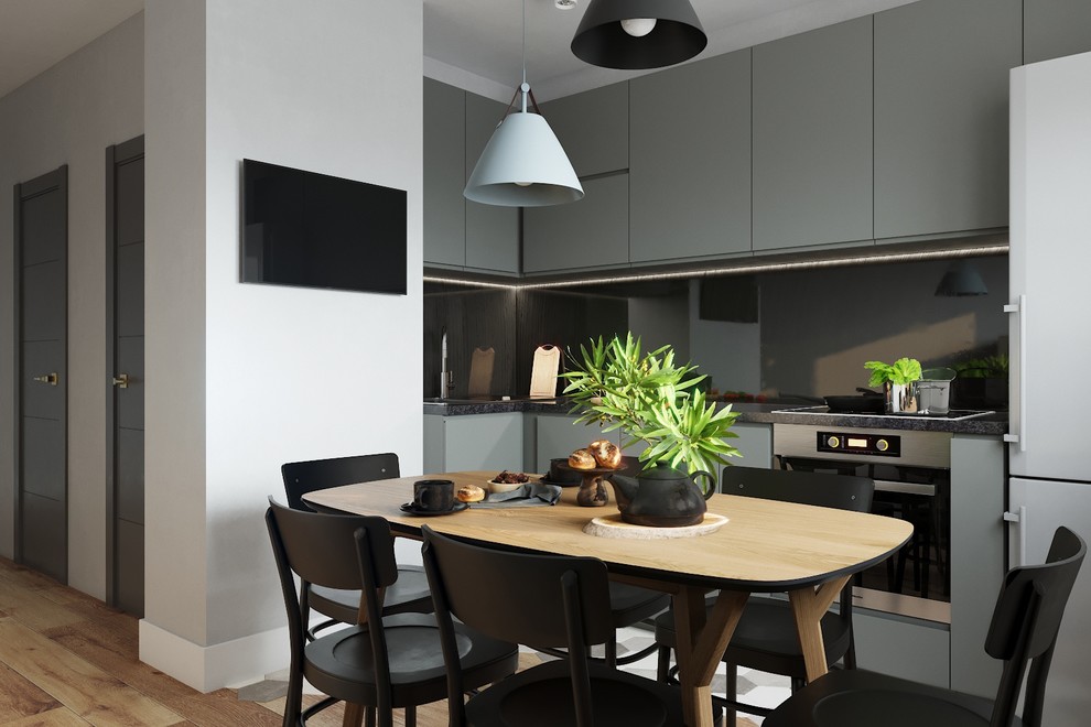 Кухонный фартук сделан из стекла, а столешница из искусственного камня, такие ма